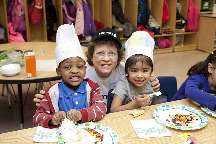 MaryJo volunteering with children